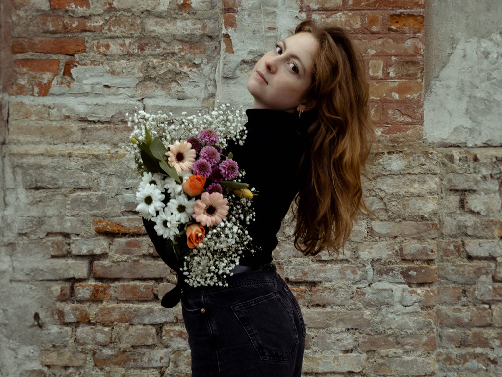 Bianca Marie & Band. The photo was taken for the album cover. Bianca Maria with a bouquet of flowers in her hand.  